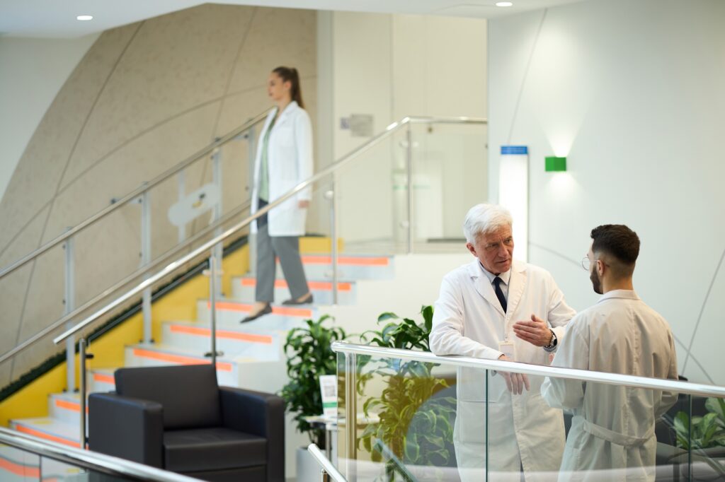 Having Discussion with Colleague in Medical Facility